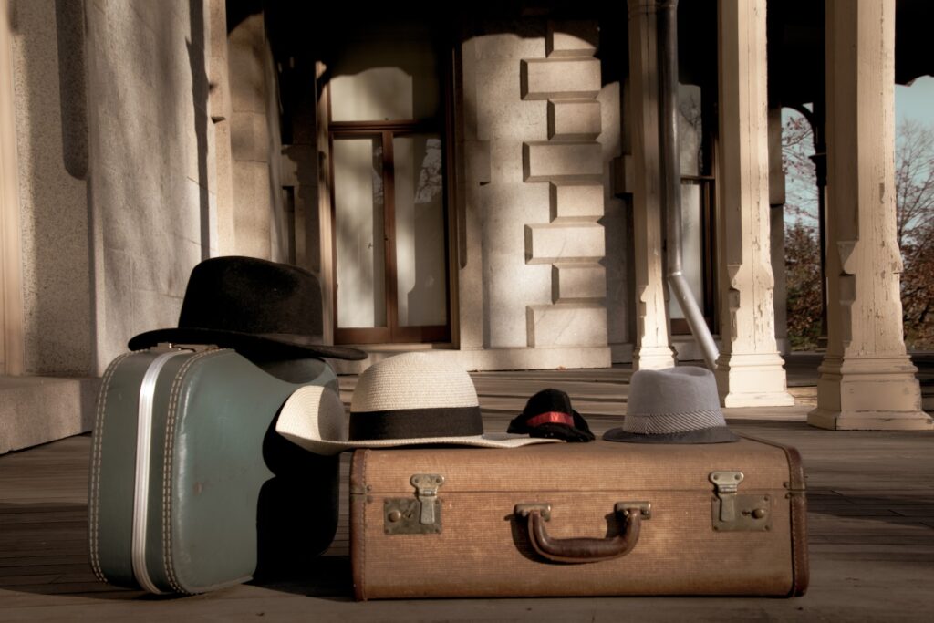 red and black cap on brown wooden chest box